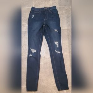 Super high rise distressed jegging